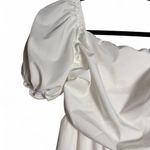 Size medium flowy white dress with runching in the back and puffy sleeves Photo 2