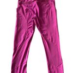 Lululemon Magenta color leggings, two side pockets, one back zip pocket, excellent condition Measurements: Waist: side to side 14-16 inches Inseam: 22 inches Photo 4