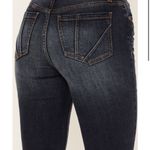 Shyanne NWT  WOMEN'S DARK WASH MID RISE SLIT BOOT CUT JEANS. Size 28/34  Dark wash Whiskering and handsanding details Yoke stitching on front Front seams down leg with bottom slit Bootcut 4 pocket construction with signature embroidery on back Zip-fly with button closure  leather logo patch on back waistline Imported Machine wash cold, tumble dry low Style: SWSP23J89 Photo 3