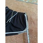 Under Armour  HeatGear Running Shorts Black White Women’s M Medium Loose Fit Photo 6