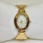 Women’s gold tone quartz watch 25mm oval cuff bangle bracelet size 6.5” running Photo 0