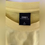 Obey Yellow  crop sweatshirt size large Photo 2