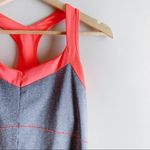 New Balance • Quick Dry Racer Back Workout Tank Top in Grey/Orange, Size Medium Photo 3