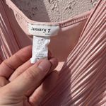 January 7  Medium light pink ruffle V body suit Photo 3