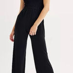 SO  Black Shoulder Tie Smocked Wide Leg Jumpsuit Photo 0