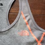 The North Face women's tank size small gray with neon orange details dri fit Photo 1