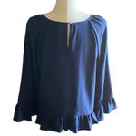 A New Day NWOT- Beautiful navy blue top, ruffle hem, embroidered cuffs , new without tags, size medium Measurements: Bust: armpit to armpit 19 inches Length: shoulder seam to bottom 23 inches Photo 3