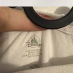 Official Walt World 50th Anniversary Mickey Mouse graphic t-shirt in white. Features classic Mickey with gold “Walt Disney World 50” logo. . Photo 1