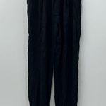 Lovers + Friends  black pull on ruffle hem pants size Medium Photo 0