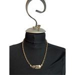  gold toned chain necklace with “guess” plated name plate Photo 1