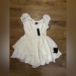 Lulus  CONSIDERABLY CUTE WHITE SWISS DOT BUSTIER
RUFFLED ROMPER Photo 1