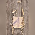 Expressions NYC Vegan Leather w/ Suede Fringe Crossbody Bag in Cream. Photo 1