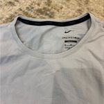 Nike women’s Light Gray top Photo 1