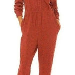 Free People rust colored eyelet jumpsuit zip up size 4β Photo 0