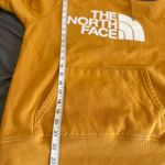 The North Face  Women’s Sz: M Hoodie Sweatshirt Mustard Yellow Logo Pullover. Photo 5