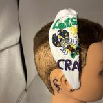 Headband absolutely gorgeous. It appears to be a Mardi Gras.​ Photo 1