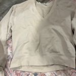 AGOLDE  Low V-Neck Balloon Sleeve Cotton Sweatshirt in Beige Neutral Photo 10