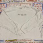 American Eagle Cropped Daisy Crewneck Sweatshirt Photo 0