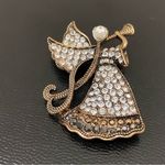 Monet Vintage  Signed Antique Brass-tone Rhinestone Angel Playing Trumpet Brooch Photo 2