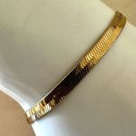Gold tone flat herringbone bracelet Photo 1
