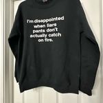 Gildan Sweater long sleeve is a size small Photo 1