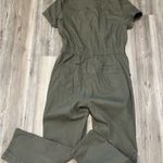 Khaki green jumpsuit with button Photo 1