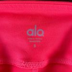 Alo Yoga Alo Mid Rise Stash Pocket Leggings in Bright Coral Size Small Photo 2