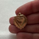 Gucci  zipperP.  shape of a heart with pink border line Photo 1