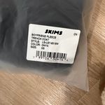 SKIMS  Onyx Boyfriend Fleece Trench Coat Photo 1