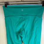 Athleta  Revelation Laser Cut Kelly Green Powervita 25" Leggings Pockets Size M Photo 7