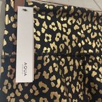 AQUA  black and gold animal print 7/8 leggings. Photo 8