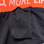 Orangetheory  Women's Athletic Shorts in Gray with Orange Accents Photo 11