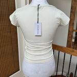 We Wore What  Women's Cream White V-Neck Ruched Top cotton spandex fitted ivory Photo 1