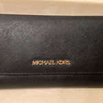 NWOT Michael Kors Jet Set Travel Large Trifold Wallet Leather Black with Gold Photo 0