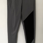 Gymshark  Gray Black Colorblock Asymmetrical Leggings Side Pockets Stretch Sz XS Photo 0