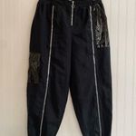 Nike  Sportwear Icon Clash Pants in Black Zippered Leg Pocket Detail Size M Photo 0