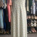 Alyn Paige Long Dress: Elegant 90’s sleeveless dress features A-line silhouette, perfect for any occasion. The delicate fabric drapes beautifully, providing a flattering fit. This timeless piece can be dressed up or down, making it a versatile addition to your wardrobe. Ideal for summer gatherings or evening events, it's a must-have for style enthusiasts. Photo 0