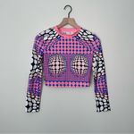 Trendingā Dynamic Polka Dotted Long Sleeve Crop Top Pink Photo 0