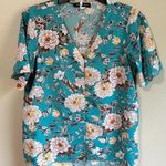 The Neck down medium light blue top Blue Photo 0