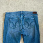 Hollister New with tags  low rise boot cut blue jeans in size 20s or 35 short Photo 3