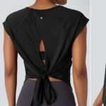 Halara Round Neck Cap Sleeve Split Tie Back Curved Hem Yoga Sports Top Photo 1