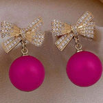 Gold and Pink Bow Earrings Photo 0