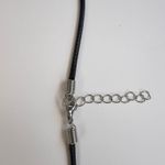 Silver sun with black leather cord Photo 2