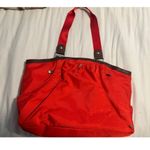 Baggallini Red/Orange Nylon Travel Tote Bag With Brown Accents & Multiple Compartments Photo 3