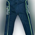 Under Armour Women’s  leggings - size XL - black w/neon green stitching - pockets Photo 1