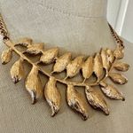 ALDO  gold tone feather leaf pendant necklace Photo 1