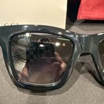 Gucci GG1714S cat-eye sunglasses with a black frame and solid grey lenses Photo 6