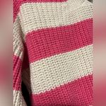 Jessica Simpson , pink and off-white striped cropped cardigan.￼ Photo 7