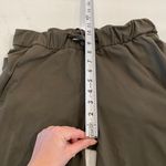 Lululemon On The Fly Crop Pants in Dark Olive size 6 Photo 9
