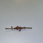 Vintage 1970s gold tone feminine bar brooch with red stones Photo 1